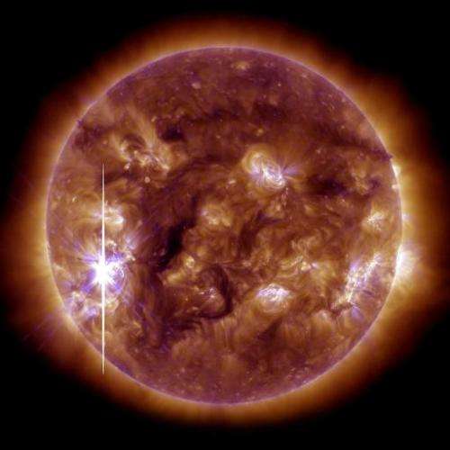 An image released on November 5, 2013, shows the sun brightening when an X-class solar flare bursts from a large, active sunspo