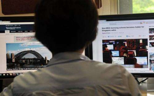 A person browses through media websites on a computer in Singapore, on May 30, 2013