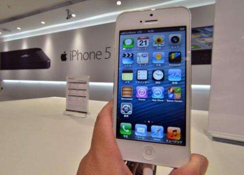 Apple's iPhone 5 smartphone is displayed at the Softbank mobile phone shop in Tokyo on September 21, 2012