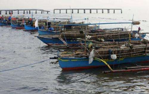 Fishing boats are moored at a fishing village in Cavite north of Manila on August 9, 2013
