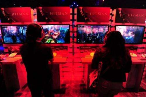 Gaming fans play Playstation 3's Hitman Absolution at the E3 videogame extravaganza in Los Angeles on June 7, 2012