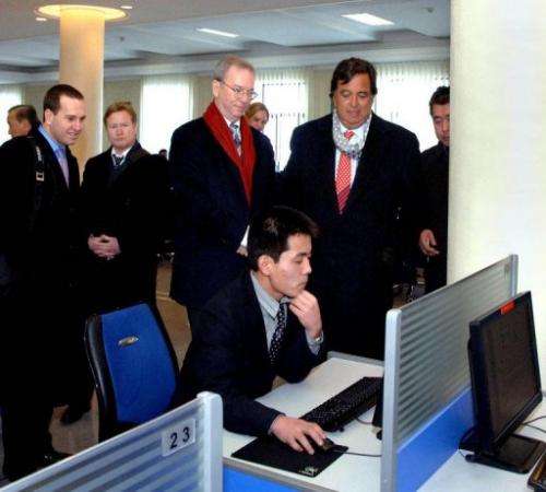 Google chairman Eric Schmidt (3rd L) is pictured on January 8, 2013 visiting an e-library at Kim Il-Sung University
