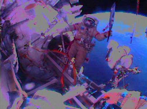 Russians take Olympic torch on first-ever spacewalk