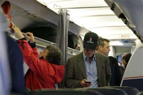 US eases rules on electronic devices on planes