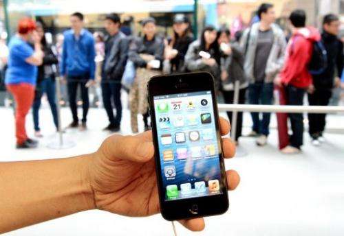 Apple's iPhone 5 is shown outside the US company's flagship store in Sydney,  September 21, 2012