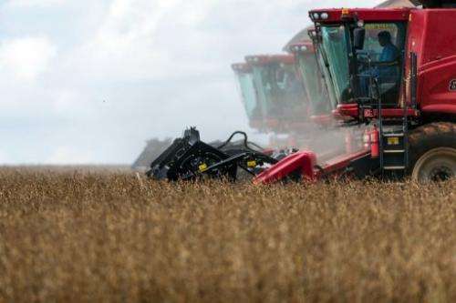 Combine harvesters crop soybeans in Campo Novo do Parecis, Brazil, on March 27, 2012