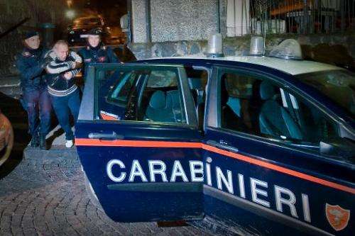 File photo shows Italian Carabinieri arresting a suspect in Naples on January 25, 2011