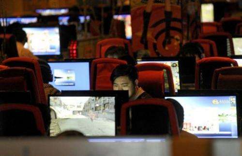 People surf the Internet at a cybercafe