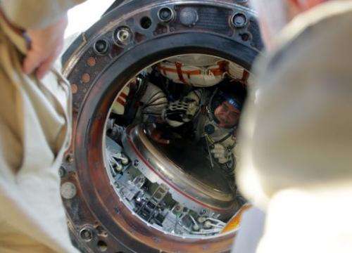 Russian cosmonauts Pavel Vinogradov is seen in a space capsule shortly after landing in Kazakhstan on September 11, 2013