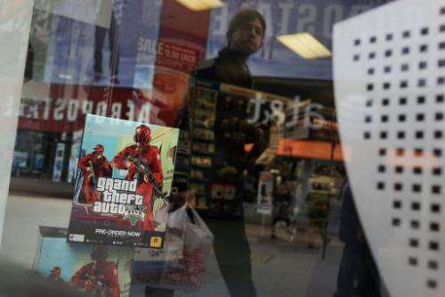 An advertisement for the new Grand Theft Auto is viewed at a Brooklyn gaming store on January 11, 2013 in New York City