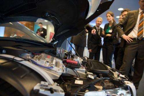 Visitors look at an Audi F12 concept car during the Electric Mobility conference on May 27, 2013 in Berlin