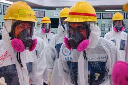 Members of the IAEA Nuclear Fuel Cycle and Waste Technology division inspect the Fukushima control room, April 17, 2013