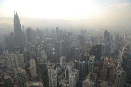 A general view of Kuala Lumpur skyline is seen covered by haze on June 27, 2013