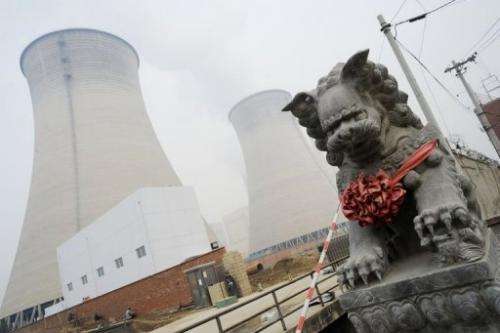 Cooling towers at a coal-fired power plant in the suburbs of Beijing on November 22, 2011