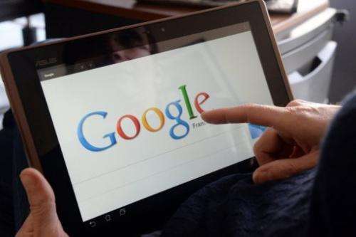 File picture shows a woman using Google on her tablet