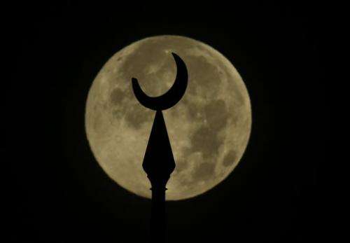 AP PHOTOS: Largest and brightest full moon of year