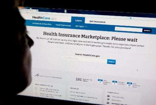 A woman looks at the HealthCare.gov insurance exchange internet site October 1, 2013 in Washington, DC