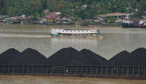 A barge on the river Mahakam ships a cargo of coal from the mining area in Samarinda, East Kalimantan, on November 10, 2013