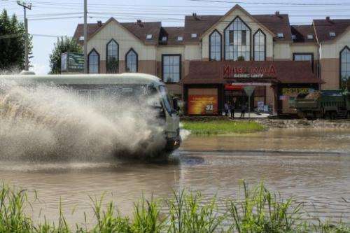 A bus operates on a flooded street, on August 21, 2013 in Khabarovsk