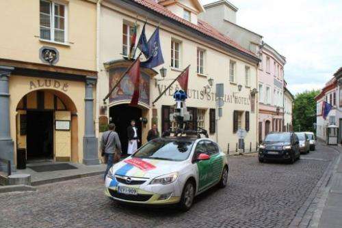 A car operating for Google Street drives through the old town in Vinius on June 7, 2012