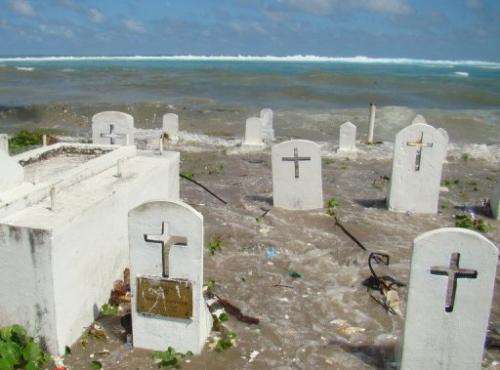 A cemetery on the shoreline of the Marshall Island's Majuro Atoll is flooded during high tide, in 2008
