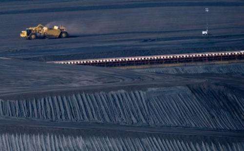 A coal scraper machine works on a pile of coal in New Haven, West Virginia, October 30, 2009