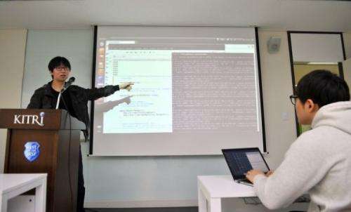 A computer research consultant teaches at the Korea Information Technology Research Institute on February 14, 2013