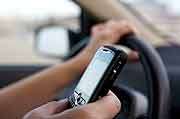 Action urged to deal with handheld phone use in cars
