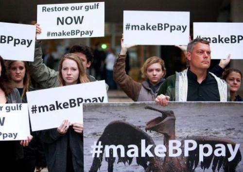 Activists protest on February 25, 2013 outside the building where the BP trial began in New Orleans, Louisiana