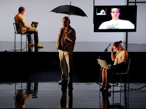 Actors rehearse a Skype chat scene from a theatre production, in Sydney, on September 12, 2012
