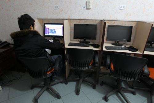 A customer is seen surfing the Internet at a cafe in Tehran, on January 24, 2011