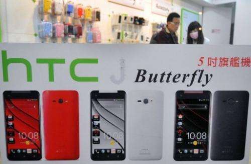 A customer visits a HTC store in Taipei on January 7, 2013