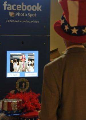 A delegate poses in the Facebook photo booth at the Republican National Convention in Tampa, Florida, on August 29, 2012