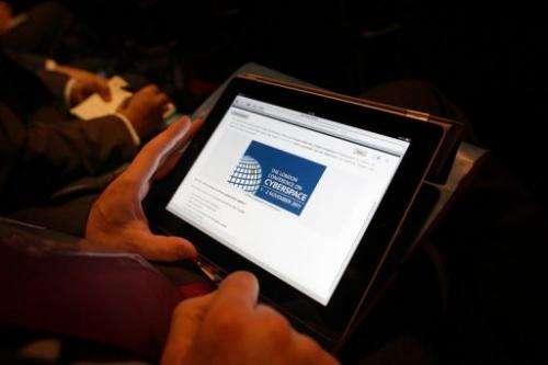 A delegate works on a tablet computer at the Conference on Cyberspace in London on November 1, 2011