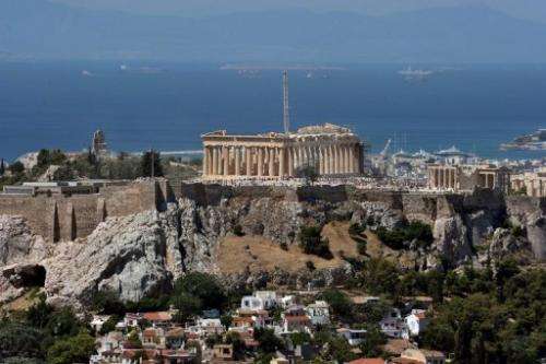A general view of Athens with the Acropolis rising above the city on June 21, 2012