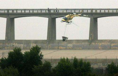 A helicopter spreads pesticide on August 15, 2005 in Los Angeles, California