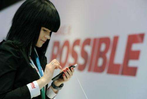 A hostess holds a Huawei smartphone, at the 2013 Mobile World Congress in Barcelona, on February 28, 2013