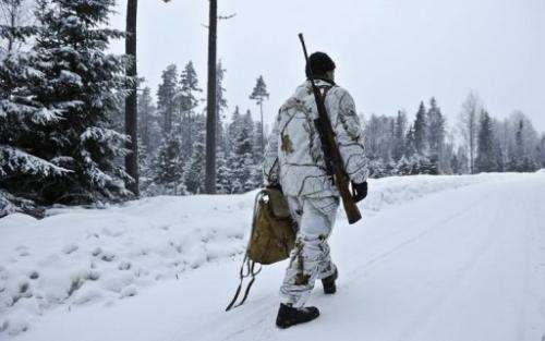 A hunter is pictured as the wolf hunt season started in Hasselforsreviret, central Sweden, on January 15, 2011
