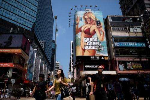 A large billboard of the &quot;Grand Theft Auto V&quot; video game is displayed in Hong Kong on September 17, 2013