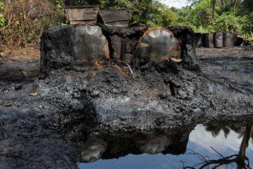 A locally built dump for crude oil waste from an illegal oil refinery in Bayelsa State, the Niger Delta, April 11, 2013