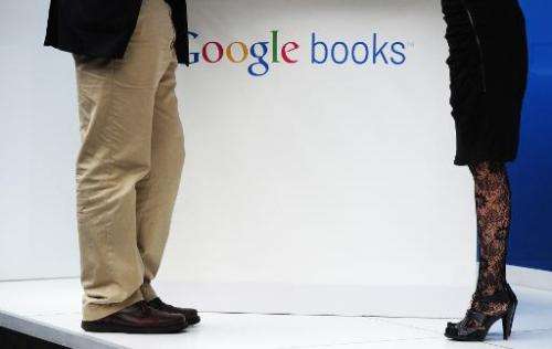 A man and a woman stand at the Google stand during the 62nd Frankfurt Book Fair in Frankfurt am Main, on October 6, 2010