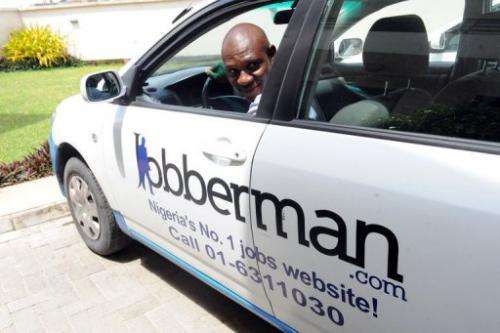 A man backs up a car belonging to the Nigerian job-finder site Jobberman, on June 17, 2013, in the Lagos suburb of Lekki