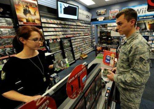 A man buys a video game at a GameStop store on November 9, 2010 in North Las Vegas, Nevada