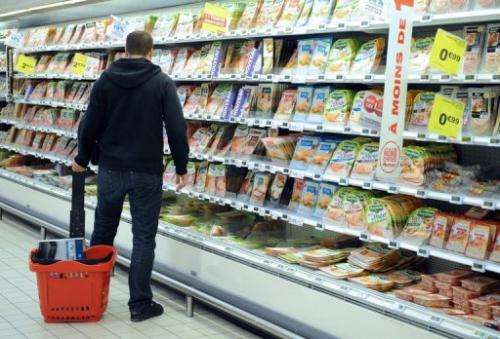 A man does his shopping in a supermarket in Saint-Sebastien-sur-Loire, western France on December 27, 2012.