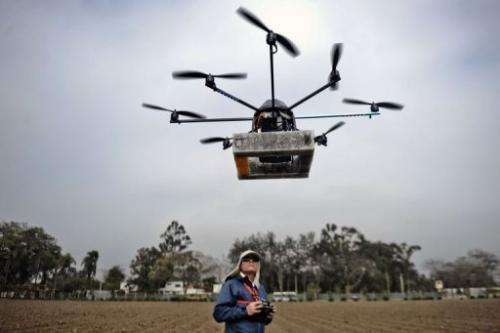 A man prepares to launch a drone in Lima, Peru on July 10, 2013