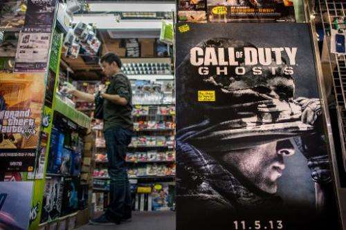A man stands at the counter of a games shop in Hong Kong on November 4, 2013