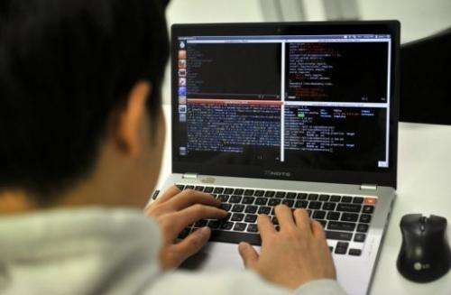 A man studies internet security at the Korea Information Technology Research Institute in Seoul, February 14, 2013