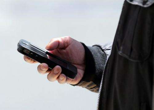 A man uses a smartphone on June 5, 2013 in San Francisco, California