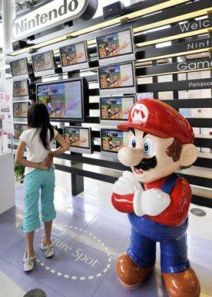 A mascot of Nintendo's popular game character Super-Mario standing at a showroom in Tokyo on July 30, 2008