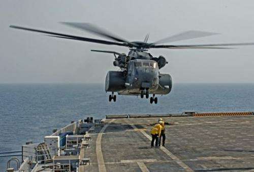 A MH53E helicopter takes off from the USS Ponce to conduct a mine clearance exercise in the Gulf on September 24, 2012